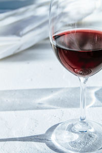 Close-up of wineglass on table