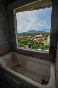 High angle view of buildings seen through window