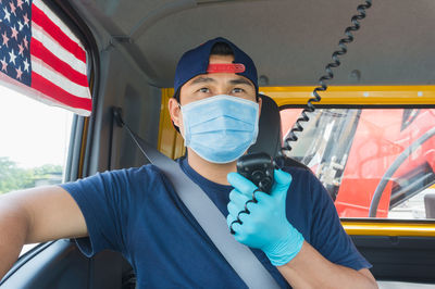 Portrait of man sitting in bus