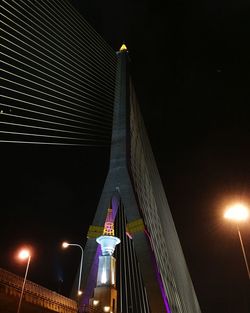 Low angle view of illuminated building against sky at night