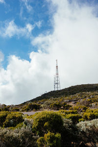 Low angle view of communications tower against sky