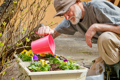 Senior man gardening in yard