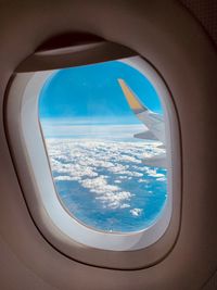 Aerial view of sea seen through airplane window