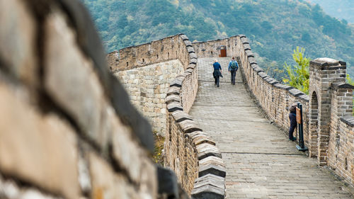 People walking in front of historic building