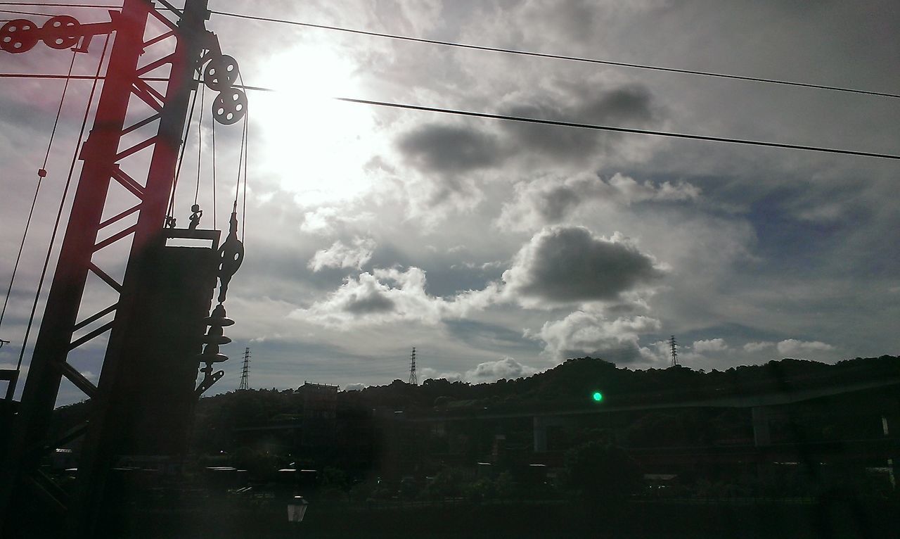 sky, cloud - sky, power line, built structure, architecture, connection, building exterior, electricity pylon, transportation, cable, low angle view, cloudy, electricity, silhouette, cloud, city, power supply, street light, dusk, mode of transport