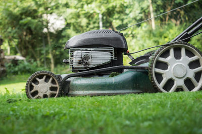 Close-up of vintage car on field