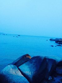 Scenic view of sea against blue sky