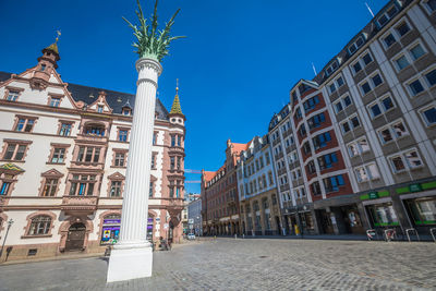 Low angle view of buildings against clear sky