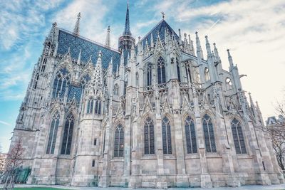 Low angle view of cathedral against cloudy sky