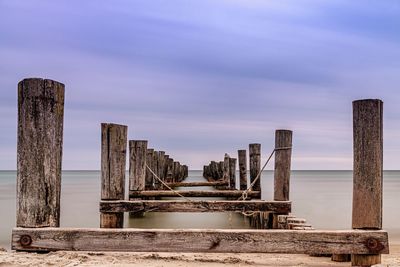 Pier over sea against sky