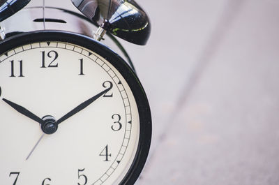 Close-up of alarm clock on table