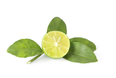 Close-up of lemon slice over white background