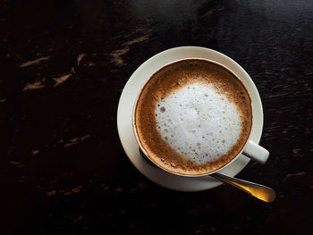 Directly above shot of cappuccino on table