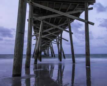 View of pier on sea against sky