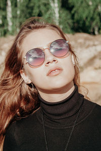 Portrait of young woman wearing sunglasses