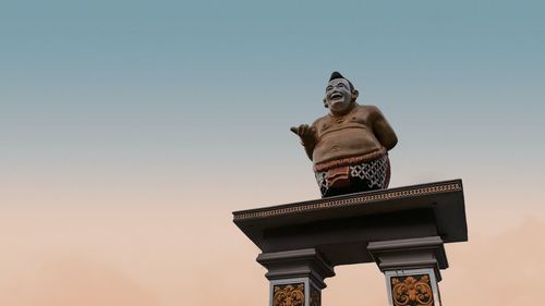 Low angle view of statue against clear sky