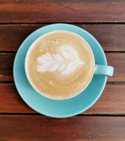 High angle view of cappuccino on table