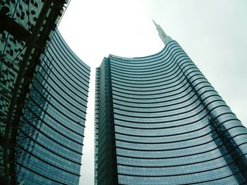 Low angle view of modern office building against sky