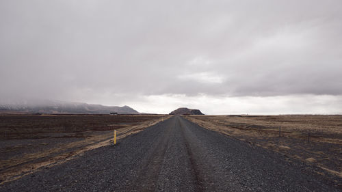 Empty road amidst landscape