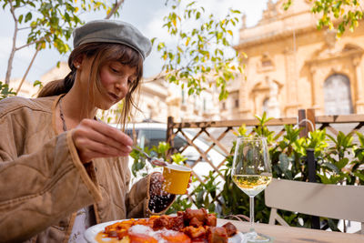 Portrait of young woman having food