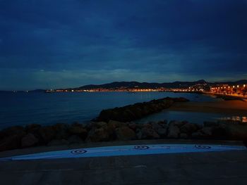 Scenic view of lake against sky at dusk