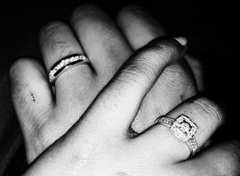 Close-up of couple holding hands