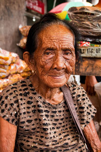 Portrait of a smiling young woman in market
