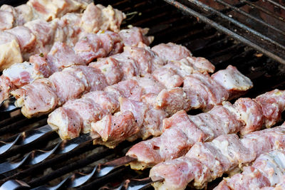 Close-up of meat on barbecue grill