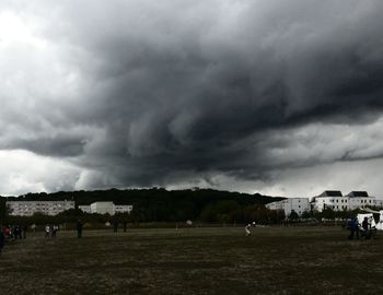 Scenic view of landscape against cloudy sky