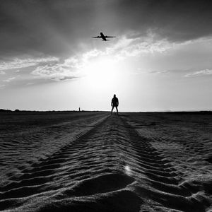 Person flying over sea