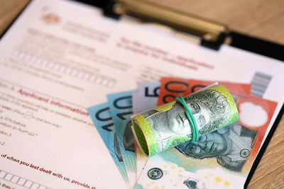 Close-up of paper currencies on table