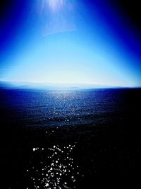 Scenic view of sea against blue sky