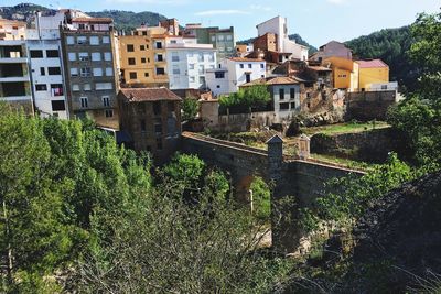 High angle view of railroad tracks by buildings in city