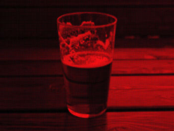 Close-up of red glass on table