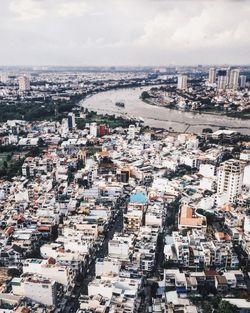 Cityscape against cloudy sky