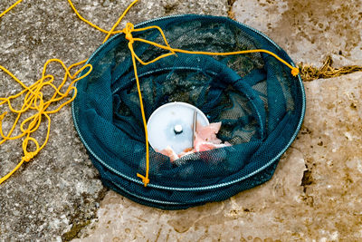 High angle view of fishing net on beach