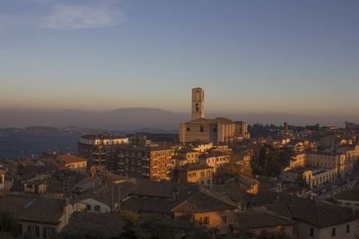 High angle shot of townscape against sky at sunset