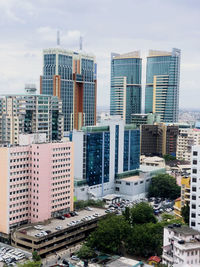 High angle view of buildings in city against sky