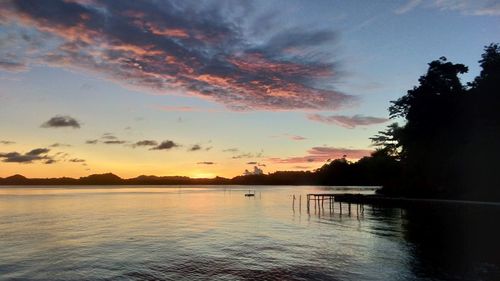 Scenic view of lake against sky during sunset
