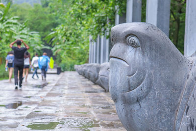 Statue against plants