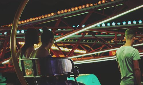 Rear view of people at amusement park