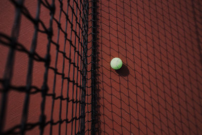 Green tennis ball on the ground