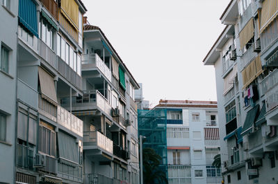 Low angle view of buildings against clear sky