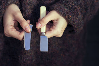 Close-up of hand holding hands with text