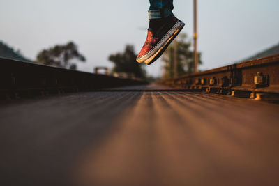 Surface level of railroad track against sky