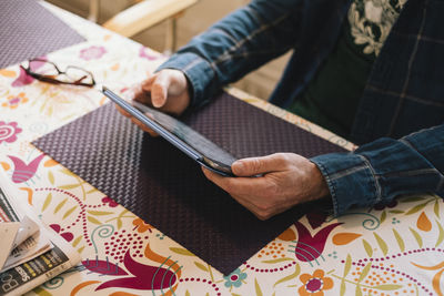 High angle view of woman sitting on table