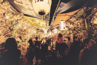 Crowd in illuminated room