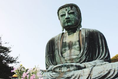 Low angle view of statue against clear sky