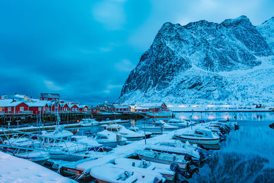 View of boat moored at harbor against mountain