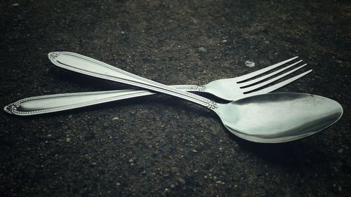 High angle view of fork on table
